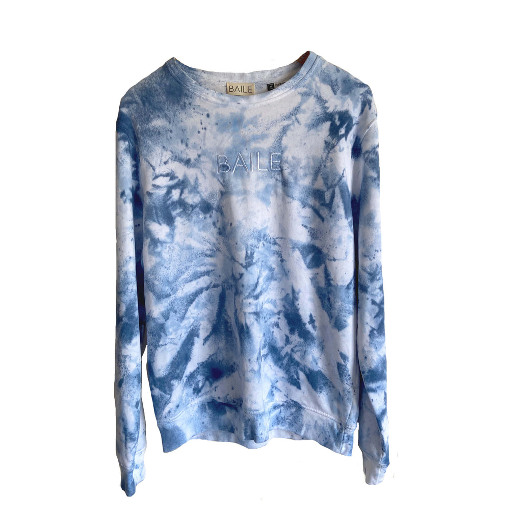 Blue hand dyed organic unisex tie dye crew neck jumper. Made from 80% organic cotton and 20% recycled polyester. Hand dyed to create bespoke designs. Irish owned sustainable brand