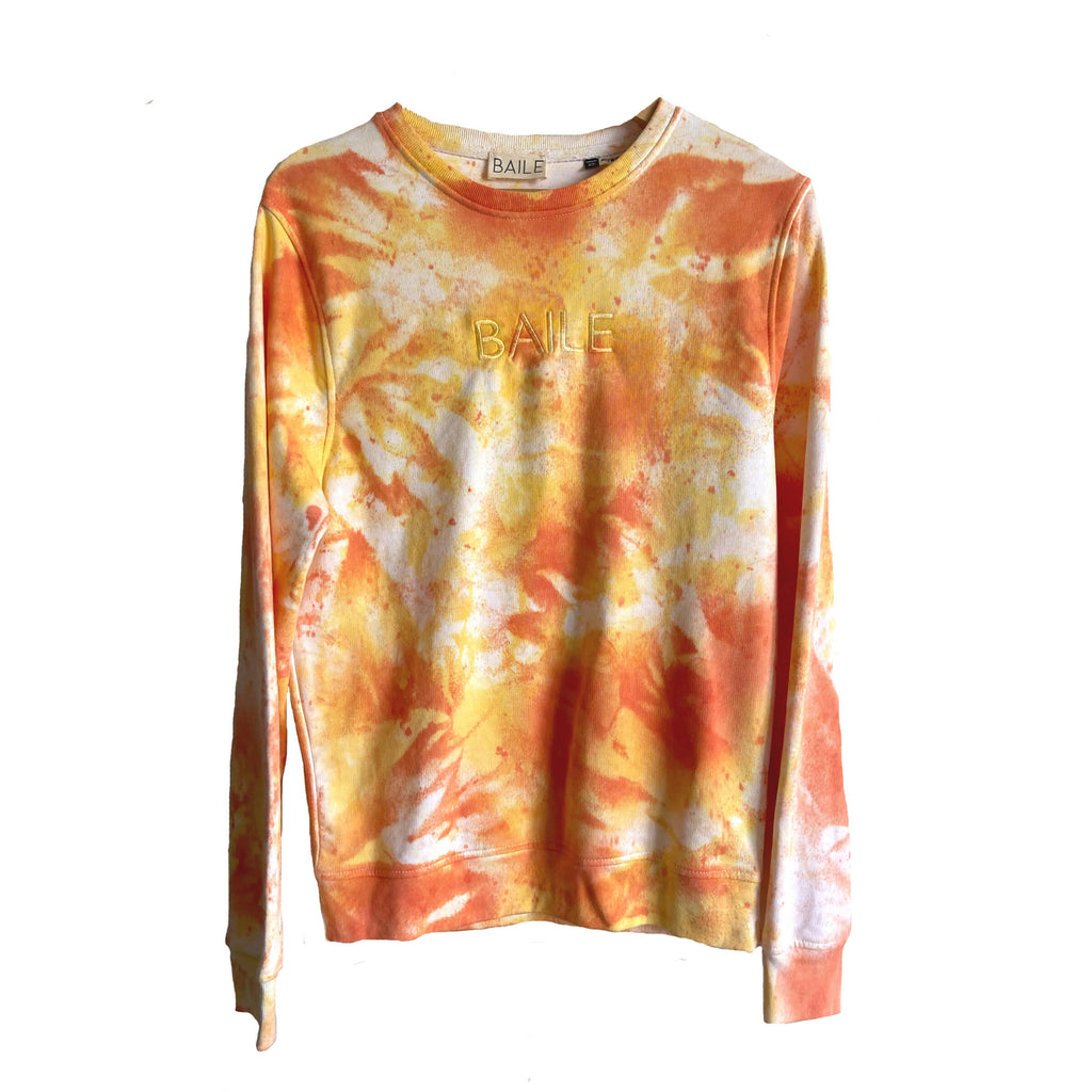 Orange and yellow hand dyed organic unisex tie dye crew neck jumper. Made from 80% organic cotton and 20% recycled polyester. Hand dyed to create bespoke designs. Irish owned sustainable brand